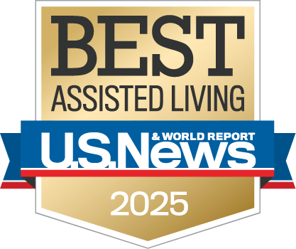 Gold and blue "Best Assisted Living 2025" badge from U.S. News & World Report, symbolizing excellence in assisted living services.